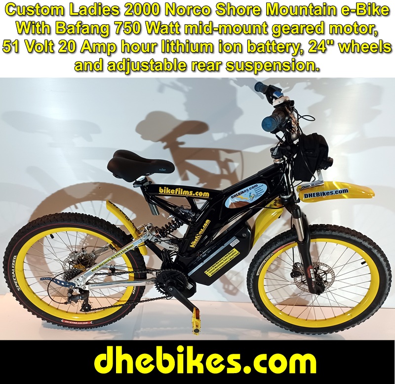 Women's custom 2000 Norco Shore Electric Downhill Mountain Bike with over 7 inches rear travel, Bafang 750 Watt 51 Volt e-bike mid-mount motor kit, Hope and Shimano disc brakes and custom machined 6061 aircraft aluminum mountain bike parts