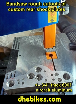 Photos showing the bandsaw cutting of the 3/4 inch thick 6061 aluminum rear suspension plates that will almost double the amount of travel.