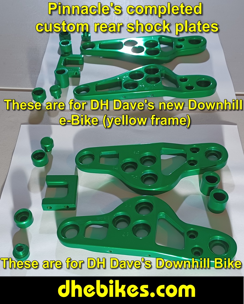 Pinnacle Innovations picture showing completed custom made and anodized suspension plates for two Norco custom downhill bike's long travel rear suspension linkage plates made from 6061 aircraft aluminum.
