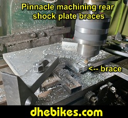 Pinnacle Innovations picture showing machining in progress of the rear shock braces for two Norco custom downhill bike's long travel rear suspension linkage plates made from 6061 aircraft aluminum.
