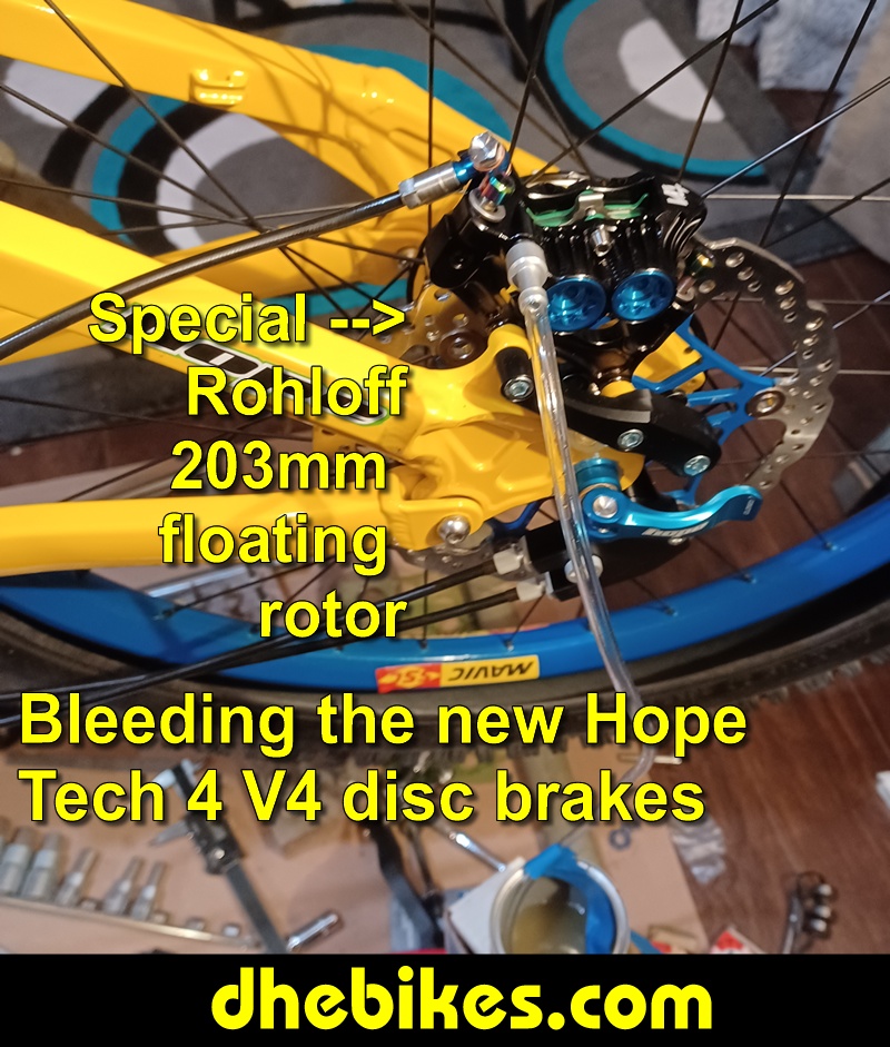 Pinnacle Innovations picture showing bleeding the new Hope Tech 4 Version 4 Downhill Mountain Bike Disc Brakes for a Norco custom electric downhill bike.